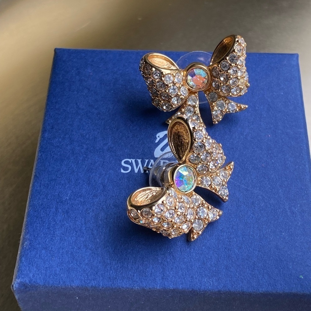 SWAROVSKI gold tone Aurora Borealis and clear crystal bow earrings